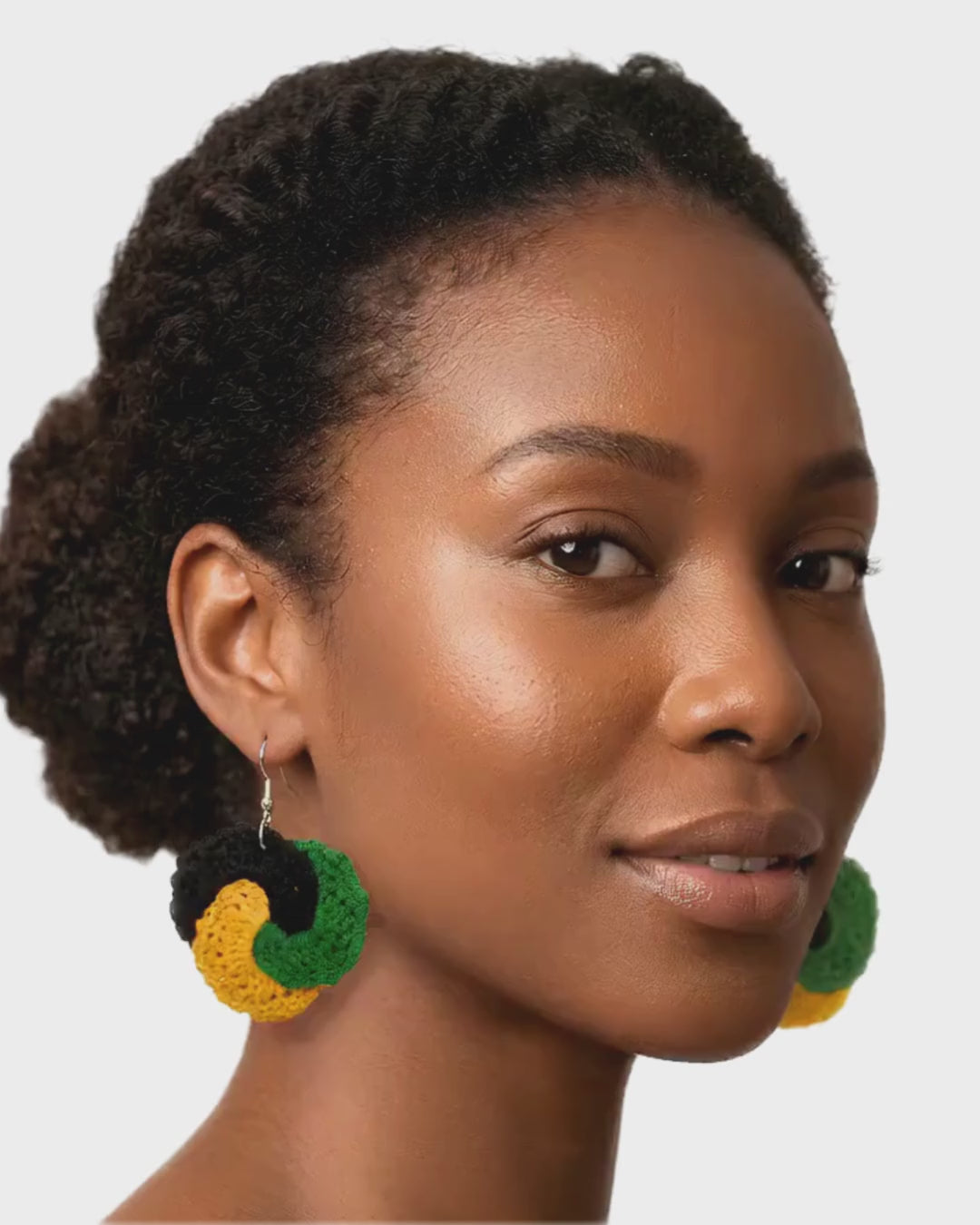Crochet Tri Circle Earrings. Color of the Jamaican flag black, green and gold.
